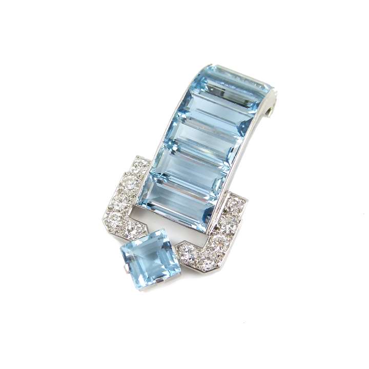 Aquamarine and diamond clip brooch by Cartier, London, of geometric buckle strap design,